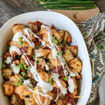 Layers of potatoes and chicken are perfectly seasoned with spicy buffalo flavor, topped with crisp bacon, sharp cheddar cheese and finished with a creamy ranch dressing.