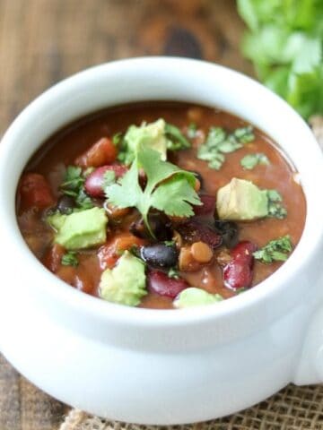Bowl of Lentil Chili topped with avocado and cilantro