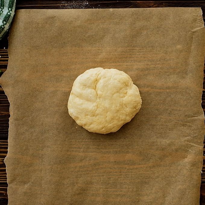Biscuit dough on parchment paper. 