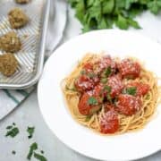 Lentil Meatballs served with pasta on a white plate