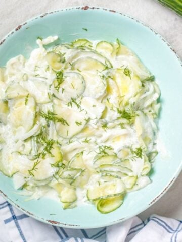 Cucumber and Onion Salad in a blue bowl