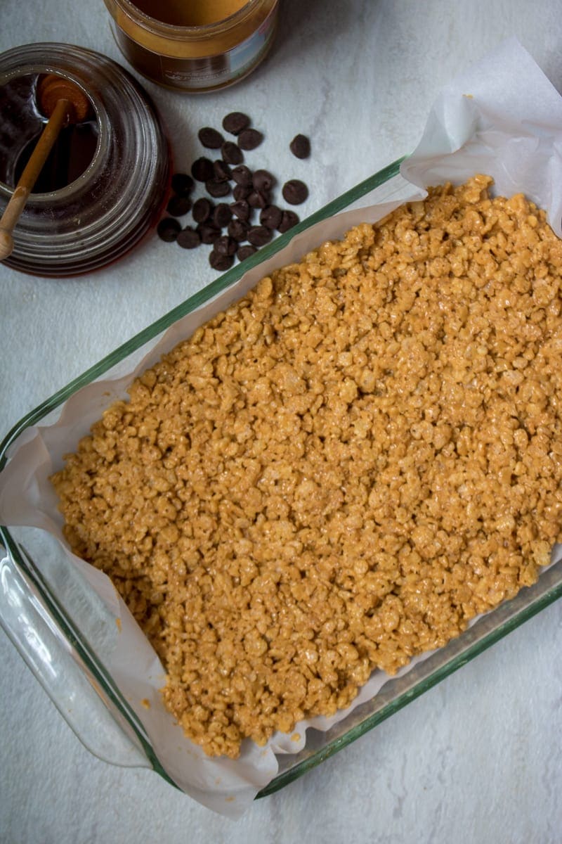 Peanut butter rice kripies made with honey in pan.