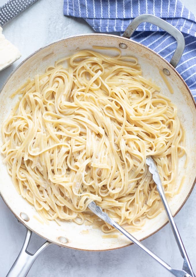 Pan of perfectly cooked fettuccine alfredo.