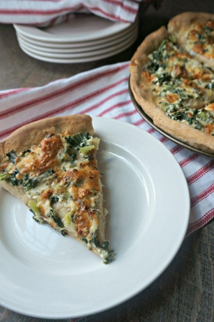 Homemade Spinach Pizza on white plate