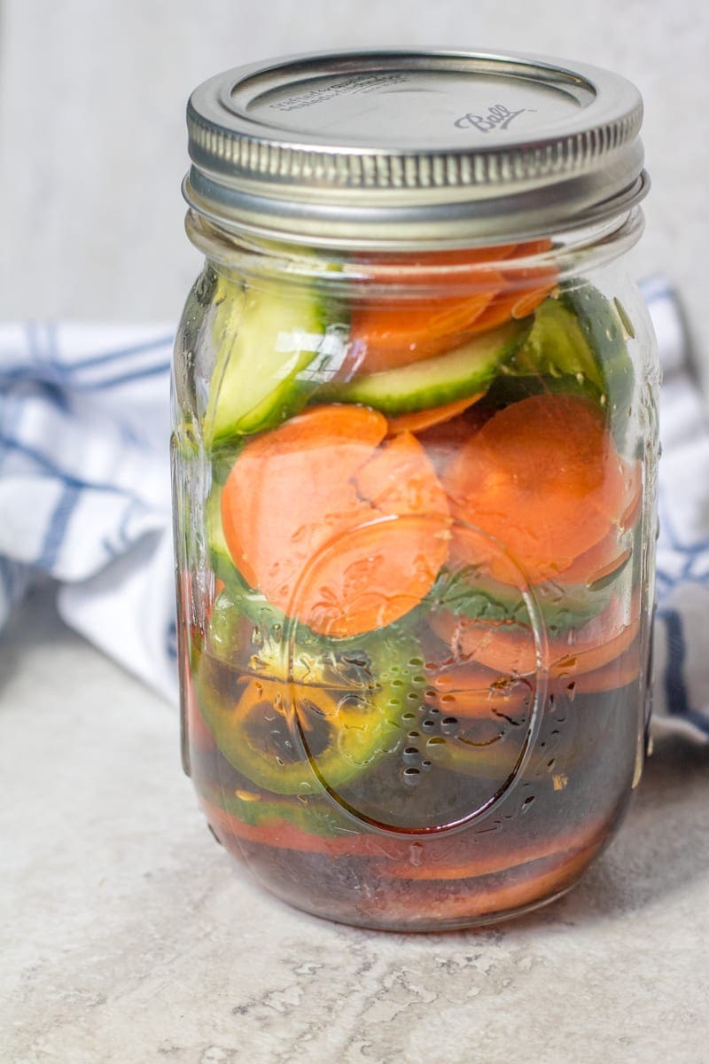 A jar of quick cucumbers and carrots