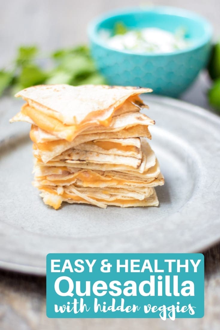 Hidden Veggie Quesadilla--A cheese quesadilla is given a healthy make-over with the addition of a layer of butternut squash puree.  This Healthy Quesadilla is Served with Cilantro Lime Cream and is the perfect way for picky eaters to enjoy veggies. 