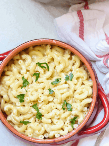 Bowl of White Cheddar Mac and Cheese topped with parsley
