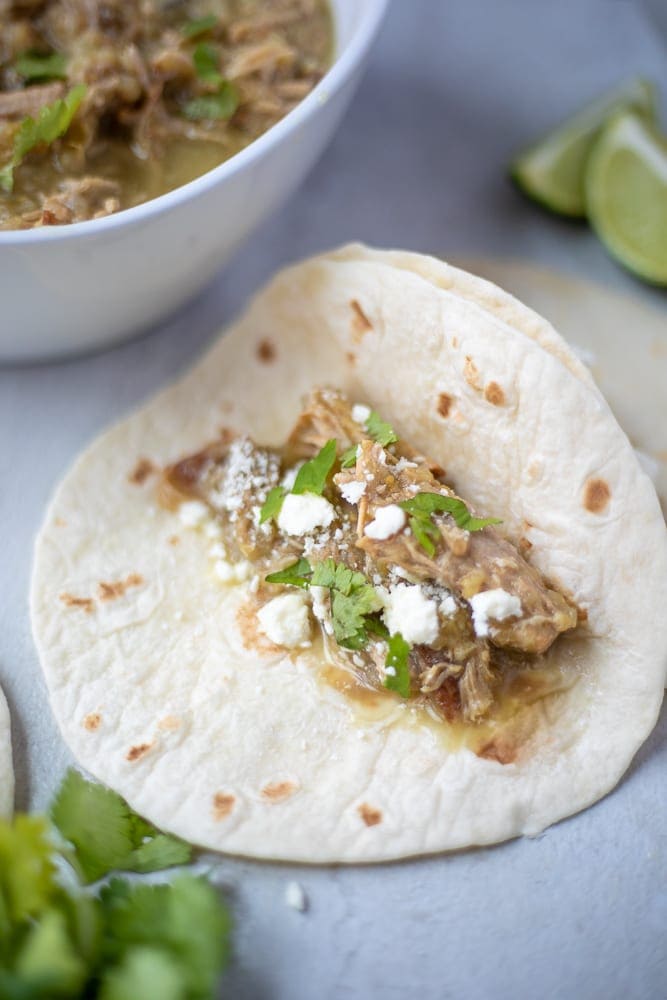 Chile Verde on a flour tortilla with queso fresco