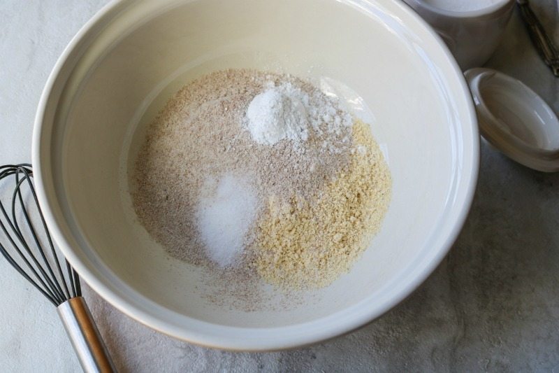 Dry ingredients for corn bread muffins in mixing bowl.