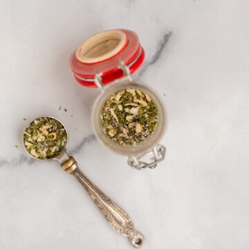Blend of dill seasoning in small spice jar.