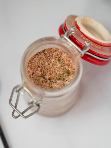 Jar of seasoning salt on counter.