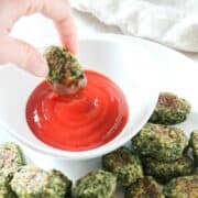 Vegetable Nugget being dipped into ketchup