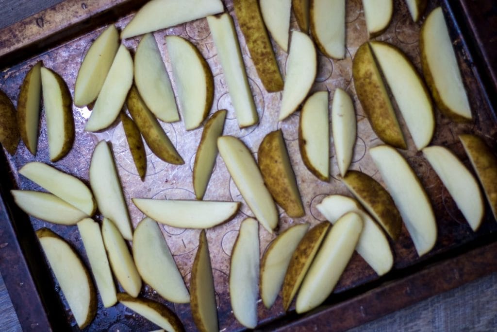 Seasoned Potato wedges on sheet pan