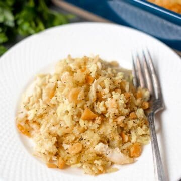 White Plate with chicken poppy seed casserole and fork