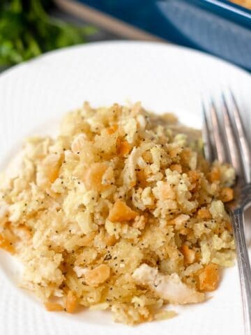 White Plate with chicken poppy seed casserole and fork
