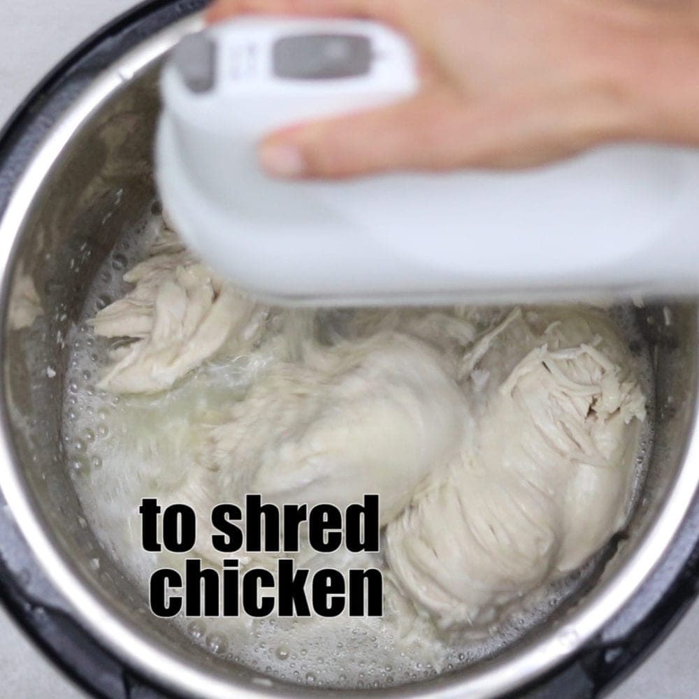 Shredding chicken with kitchen aid mixer with text that reads to shred chicken.