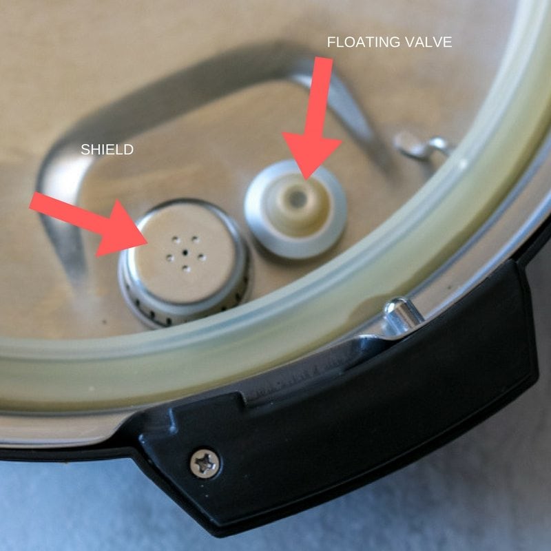 Arrows pointing to the Floating valve and shield on lid of instant pot.