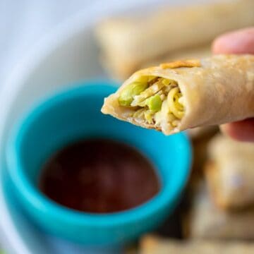 Egg Roll with bite out of it showing vegetable filling