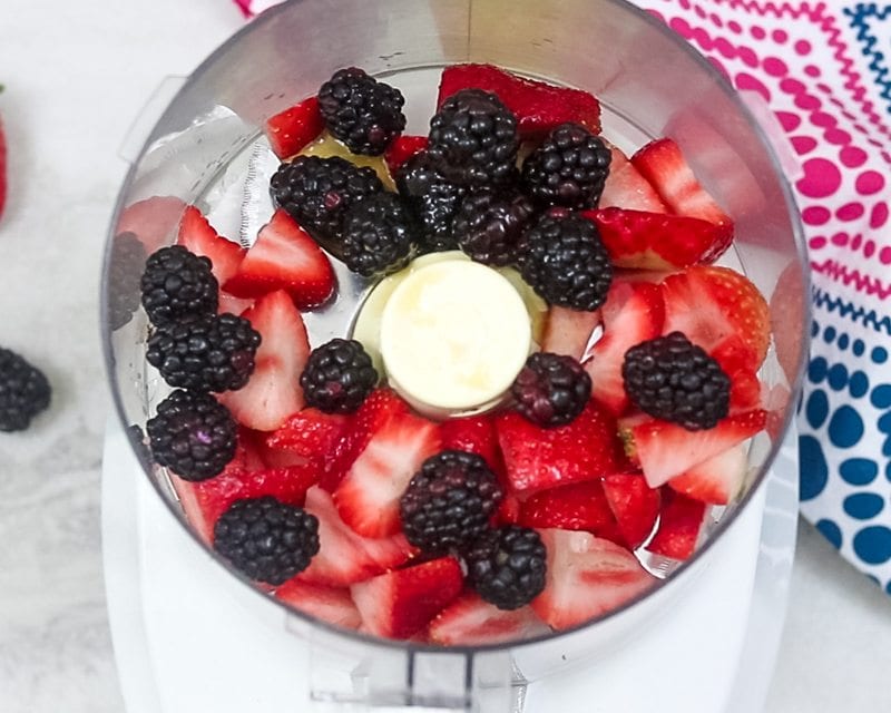 Blackberry and Stawberries in fruit processor 