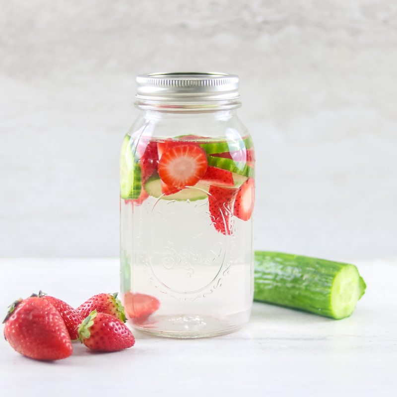 Glass Jar filled with Strawberry Cucumber water