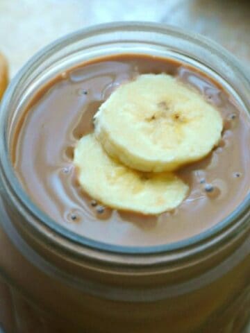 Easy Peanut Butter Chocolate Shake with bananas in glass jar