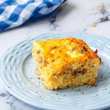 slice of egg cheese overnight breakfast casserole with sausage