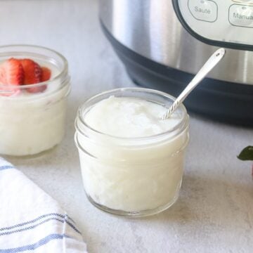 jar of plain yogurt next to instant pot
