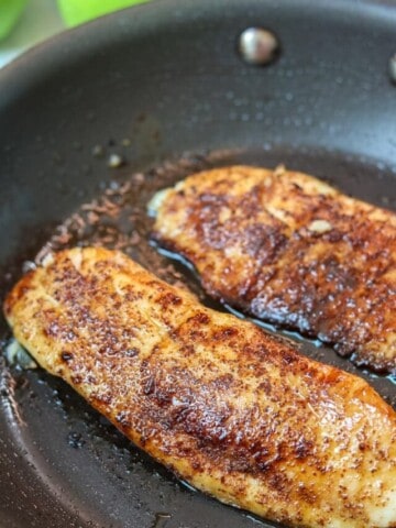Tilapia in nonstick skillet with chili lime glaze
