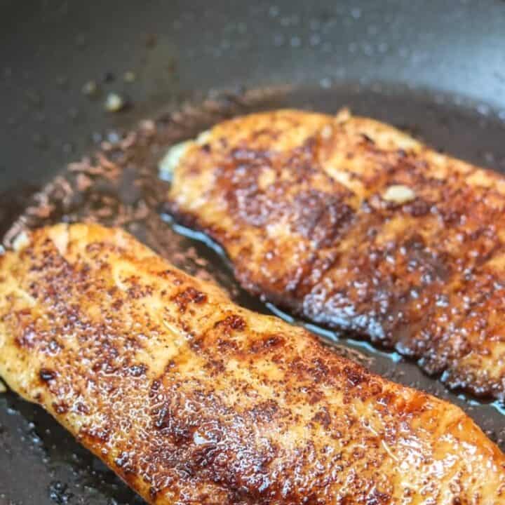 Tilapia in skillet with spice rub