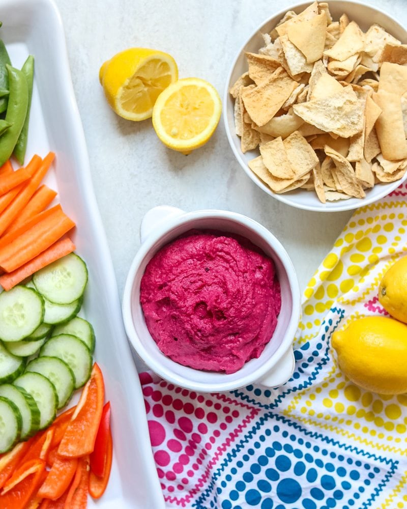 Beet hummus with vegetables and pita chips