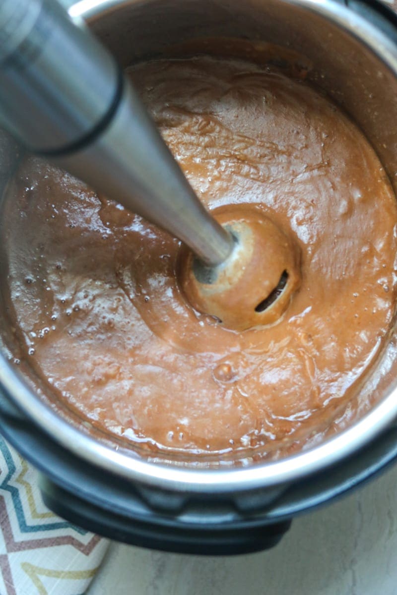 Immersion blender blending up pinto beans in instant pot.