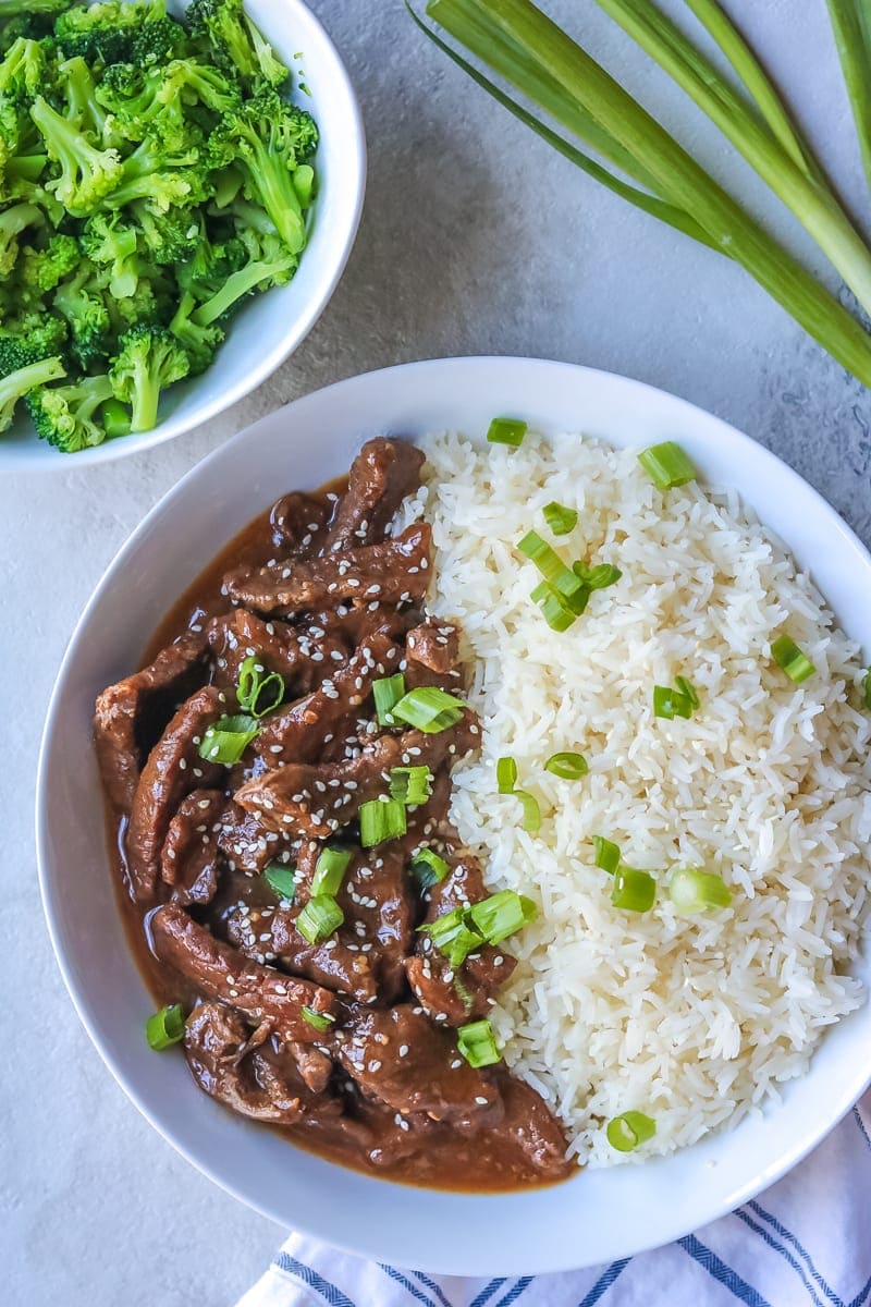 Instant Pot Mongolian Beef with Steamed Rice and Broccoli plated in a white bowl.
