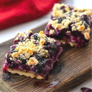Blueberry Pie bars on wooden cutting board