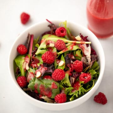Mixed greens topped with raspberry salad dressing.