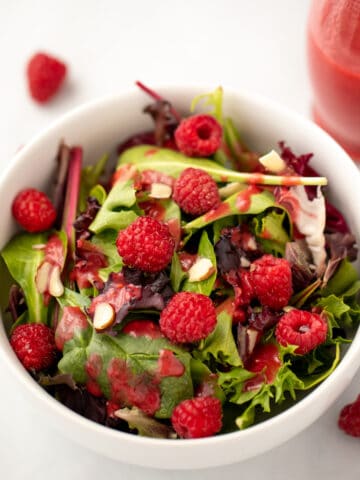 Mixed greens topped with raspberry salad dressing.