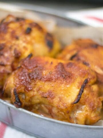 Juicy BBQ Chicken Thighs in basket for serving