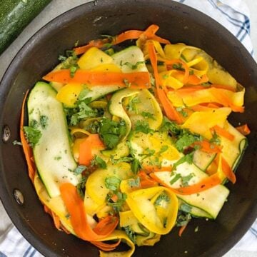 Saute pan with zucchini, yellow squash and carrot ribbons