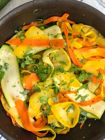 Saute pan with zucchini, yellow squash and carrot ribbons