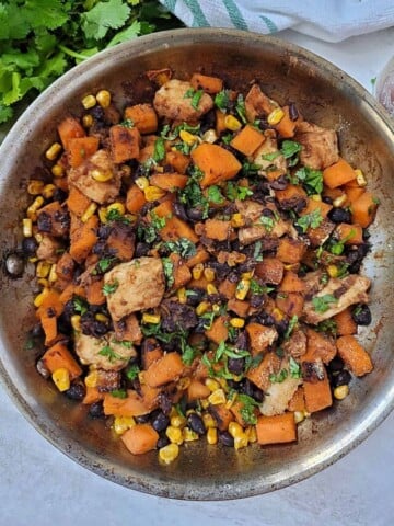 Skillet with chicken, sweet potatoes, and black beans.