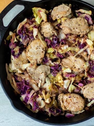 Cast Iron Skillet with Seared Pork Tenderloin and cabbage