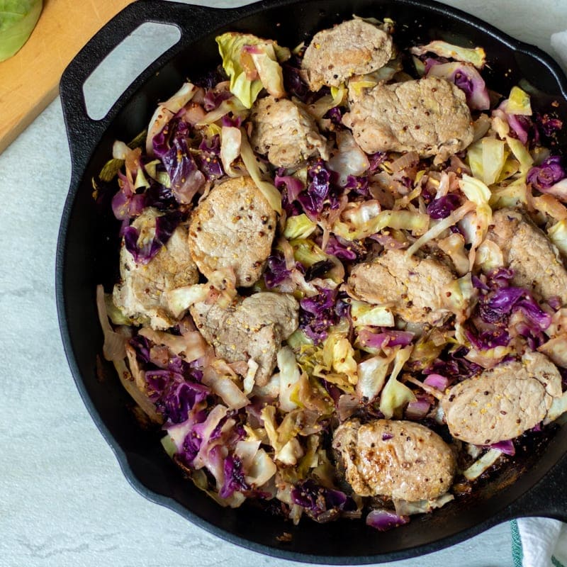Cast Iron Skillet with Seared Pork Tenderloin and cabbage