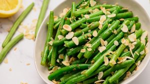 Green Beans Almondine in white serving platter