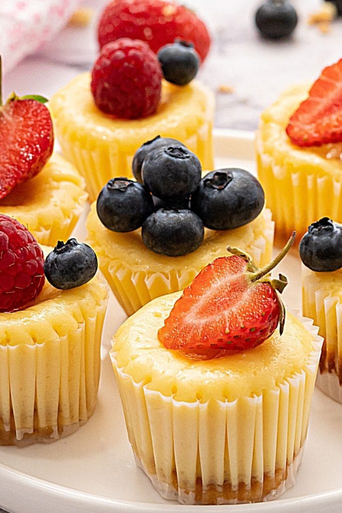 Mini Cheesecakes topped with fresh berries.
