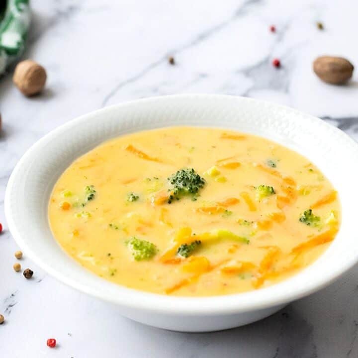 Bowl of Broccoli Cheddar soup in white bowl