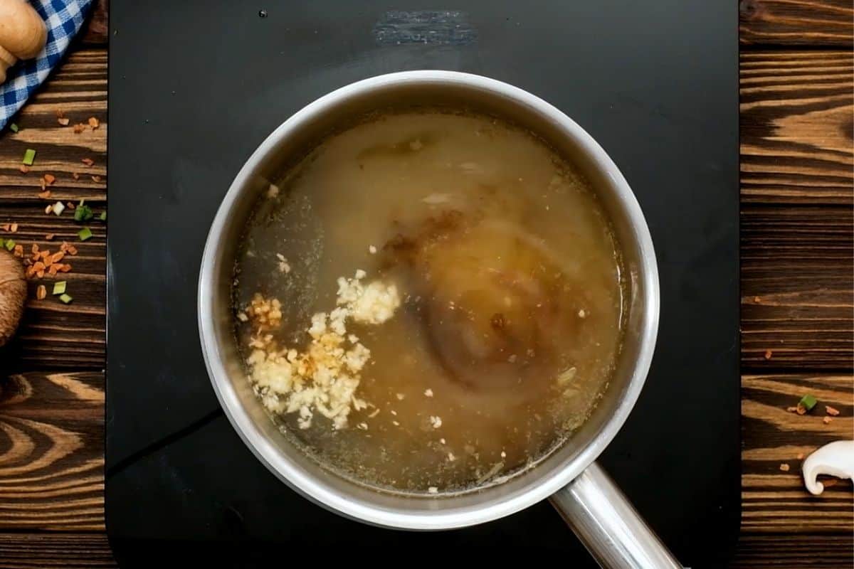 Ingredients for Ramen Broth in saucepan.