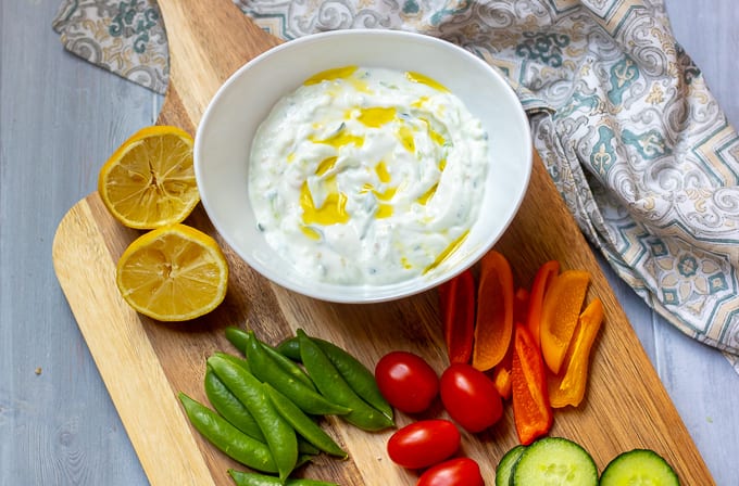 Homemade Tzatziki Sauce on tray with vegetables.