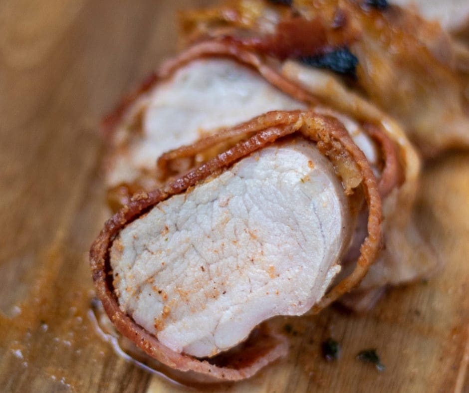 Sliced Pork Tenderloin that has been wrapped in bacon.