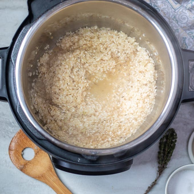 Wine and rice in inner pot of pressure cooker