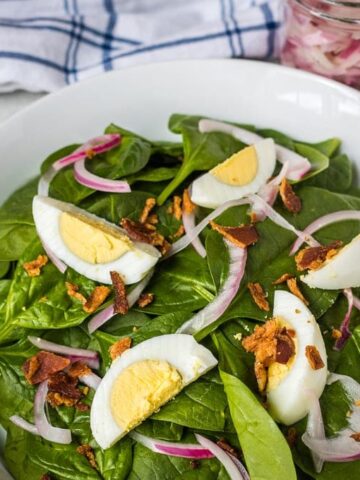Spinach Salad with Hard Boiled Eggs and thinly sliced onions