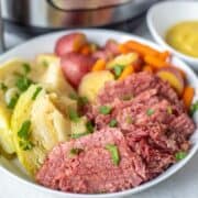 Corned Beef and Cabbage on White Platter with Potatoes and Carrots